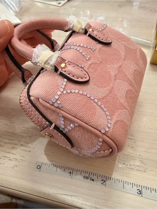 Coach Accessories - Coach pink denim Rowan bag charm
